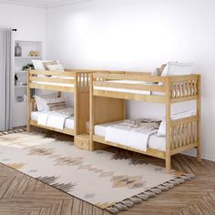 there are two bunk beds in the room with white walls and wood flooring, along with a rug on the floor