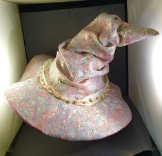 a pink hat sitting on top of a table