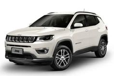 a white jeep compass parked in front of a white background