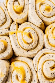 rolls with mustard and poppy seeds on them are ready to be baked in the oven