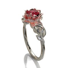 "This amazing engagement ring positively radiates beauty and strength. With its vibrant colors and lovely floral design, it's sure to be a conversation starter. Choose this piece of fine jewelry for someone with a unique spirit. The narrow band is created from gleaming, 14kt white gold, with a symmetrical design of white gold leaves at the top, which surround a beautiful lotus flower crafted from warm rose gold. At the very center sits a glistening, vivid ruby. ★See A Video Of This Amazing Ring Chique Outfits, Cute Engagement Rings, Pola Gelang, Magical Jewelry, Jewelry Accessories Ideas, Dream Engagement Rings, Jewelry Lookbook, Fancy Jewelry, Cute Rings