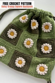 a crocheted bag with flowers on it