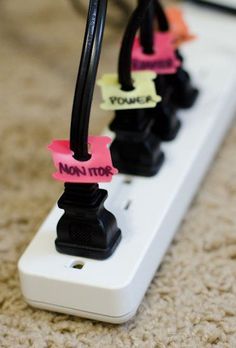 the words use bread tags to label power cords via apartment therapy are written in pink and black