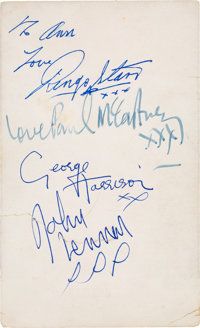 an old book with autographs written on the front and back pages, including one in blue ink