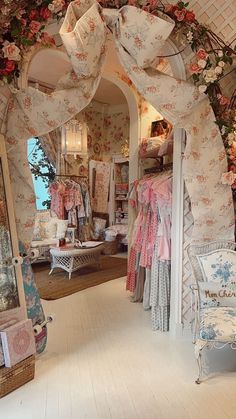 the inside of a clothing store with floral decorations