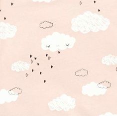 a pink background with hearts and clouds in the sky, all drawn by hand on paper