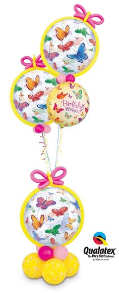 three helium balloons with butterflies on them