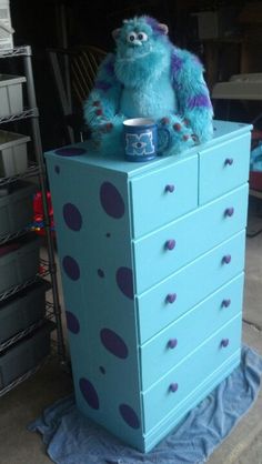 We painted a hand me down dresser for the boys room to look like sully from monsters inc. Upcycling, Monsters Inc Bedroom, Monsters Inc Room, Pixar Nursery, Sully From Monsters Inc, Monsters Inc Nursery, Monster Room, Disney Themed Nursery, Monster Nursery