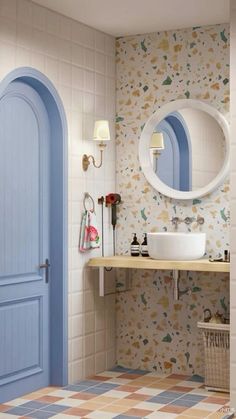 a bathroom with a blue door, sink and mirror on the wall next to it