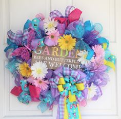 Garden Welcome Mesh Wreath, Bees Butterflies Front Door Hanging “Welcome To My Garden.”  This wreath is made with lavender, blue, purple pink ruffles and curls. Lots of matching ribbons with sparkling solid colors, plaids, and butterflies and bees surrounded by pretty blue, yellow, white and pink flowers. Flowers are attached with wire, not just glued on. Iridescent tubing peeks out from the mesh and ribbons to add a bit more sparkle. Three delicate butterflies sit atop the flowers. In the cente Front Door Hanging, Welcome To My Garden, Ribbon Wreaths, White And Pink Flowers, Summer Wreaths, Ribbon Wreath, Welcome Wreath, Lavender Blue, Pink Ruffle