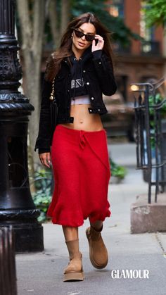 Ratajkowski completed the look by stacking a black denim jacket over a cropped white tank top and even more cropped black hoodie. And while her choice of footwear was demonstrably casual, her cat-eye sunglasses and black purse with gold detailing gave the overall look a refined edge. Fashion Models, Ugg Boots, Couture, Zendaya Model