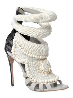 a high heeled shoe with pearls on it