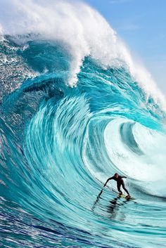 a man riding a wave on top of a surfboard in the ocean with a quote above it