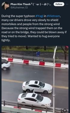 two white cars driving down a road next to each other