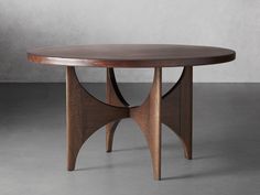 an oval wooden table with two intersecting legs and a circular top, on a gray background