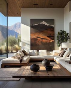 a living room filled with furniture and a painting on the wall