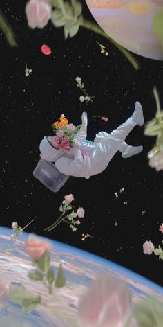 a man in white suit flying through the air with flowers on his head and body