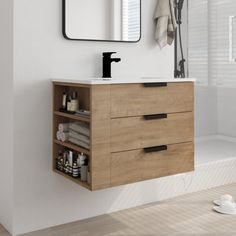 a bathroom with a sink, mirror and towel rack on the wall next to it