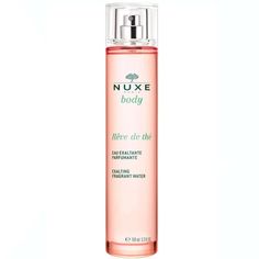 a bottle of nuxe body lotion on a white background