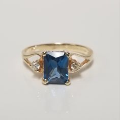 Thanks for shopping our vintage estate store. We tend to sell well below wholesale and truly hope you enjoy all of our items. Many of the items are one of a kind, so please enjoy scrolling through the pictures and hopefully something will catch your eye. Black spots are from the camera or reflections. Nice estate 10k yellow gold natural 1ct blue emerald cut topaz ring with .05ct diamonds in the setting. Beautiful older style ring. Topaz is testing natural. There are 2 diamonds in the setting. Ring size: 7.25 Setting: 1/4" 8mm by 11mm 3/8" Band width: 2mm Weight: 2.64 grams Gem: 6mm by 8mm Stunning ring, marked 10k. Gem is testing natural spinel or topaz, might be created but I do not think so. Topas Ring, Emerald Cut Ring, Blue Emerald, Older Style, Emerald Cut Rings, Older Fashion, Emerald Cut Diamonds, Black Spot, Topaz Ring