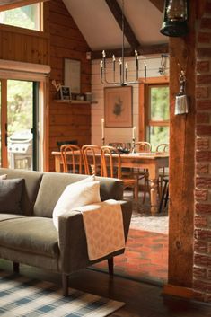 a living room filled with furniture and windows