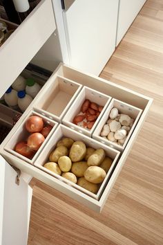 an open drawer filled with lots of different types of food in it's drawers