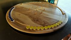 a wooden board with yellow and blue circles on it