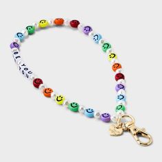 a multicolored beaded bracelet with charms