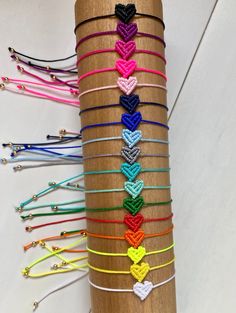 the bracelets are all different colors and have hearts on them