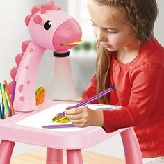 Child Smart Giraffe Style Projector Desk With Light Learning Painting Machine Toy 5ML Description: Bright Colors: The cute design makes this toy a nice gift to kids. The toy features the bright colors to be great for drawing. Educational Toy: An educational projector that can cultivate drawing skills and color. Perfect for Fun: This excellent art projector drawing set will improve childrens artistic time and let them draw in exciting way. Complete Set: The set includes the drawing machinex1, dra Learning Painting, Art Projector, Painted Christmas Gifts, 7 Month Old Baby, Drawing Toys, Drawing Machine, Drawing Table, Birthday Toys, Halloween Toys