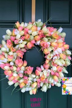 a pink and white tulip wreath on a green door with the words chick's creek written below it