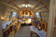 the inside of a tiny house with bunk beds