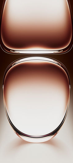 an abstract image of two oval shaped objects in brown and white colors, on a dark background