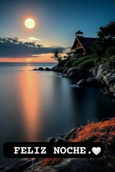 an image of a house on the shore at night with text overlay that reads feliz noche