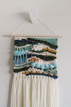 the wall hanging is made out of yarn