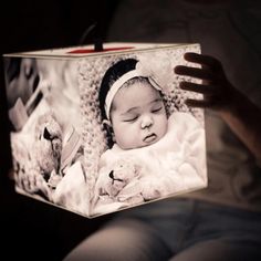 a baby is laying down in a light box