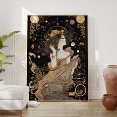 a woman sitting on the floor in front of a black and gold art print with stars