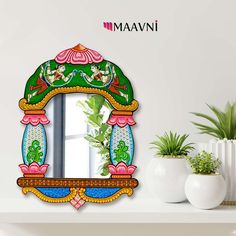 an ornate mirror on the wall next to potted plants