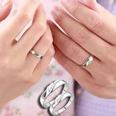 two people holding hands with wedding rings on top of each other and the words love written in