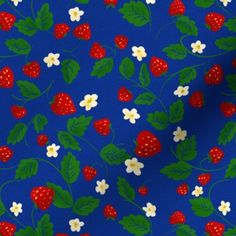 a blue background with strawberries and flowers on it