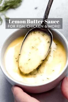 a person holding a spoon in a bowl with lemon butter sauce for fish, chicken and more