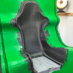 the interior of a green vehicle with holes in it