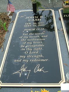 a memorial with flowers and candles on it