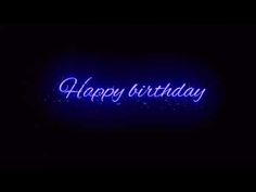 the words happy birthday are lit up in blue