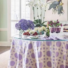 a table topped with purple and white flowers