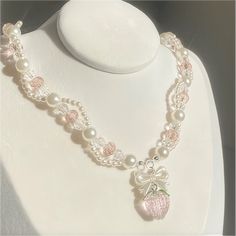 Description: Crystal Strawberry Choker Necklace Specifications:Material: crystal, copper, pearlColors: pearl whiteSize: 40 cm + 5 cm extWeight: 18 g/pcs Add a burst of fruity fun and sparkle to any outfit with our Crystal Strawberry Choker Necklace.🍓This playful piece features a charming crystal-encrusted strawberry pendant on a delicate choker chain, perfect for adding a touch of whimsy to your look.🌈 Cute Necklace Aesthetic, Strawberry Choker, Charm Necklace Aesthetic, Layered Necklaces Outfit, Crystal Necklace Designs, Cute Collars, Coquette Jewelry, Necklaces Diy, Kawaii Necklace