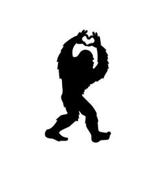 a black and white silhouette of a squatting gorilla with his hands in the air