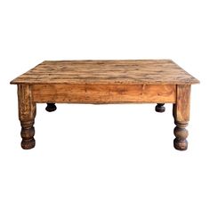 an old wooden table with two legs and a square top on it's sides