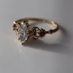 An upgraded version of the round cut ring of wisdom, this ring features a gorgeous 0.75 carat round cut pink sapphire. Bridal Attire, Cute Engagement Rings, Future Engagement Rings, Princess Diaries, Dope Jewelry, Dream Engagement, Dream Engagement Rings, Jewelry Lookbook, Wedding Rings Vintage