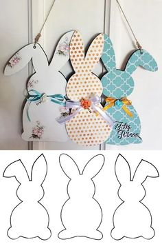 paper cut out of the shape of easter bunnies hanging on a door with ribbon